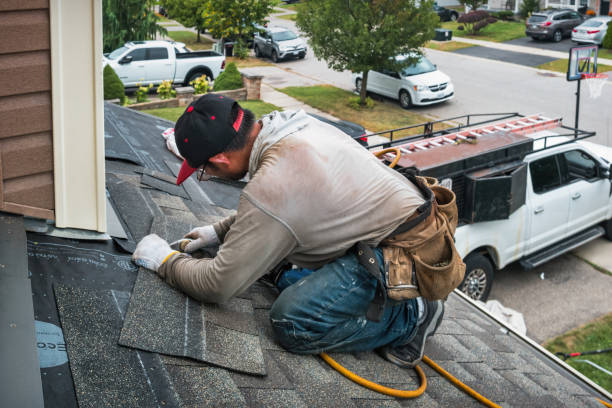 Professional Roof Replacement technician working in Cedarhurst, NY